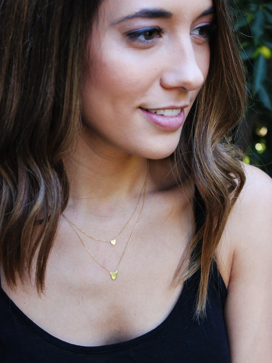 The Gentle Pit fine jewelry is perfect for layering. We adore the 14k Gold Heart Pendant paired with our signature 14k Gold Pittie Love Pendant